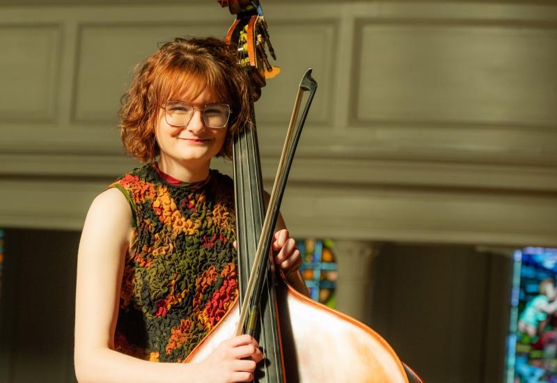 Vivian Shanley poses for a photo with her double bass.