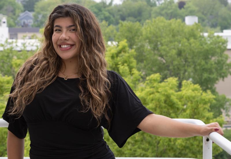 Bruna Velez is all smiles as she poses for a photo on campus.