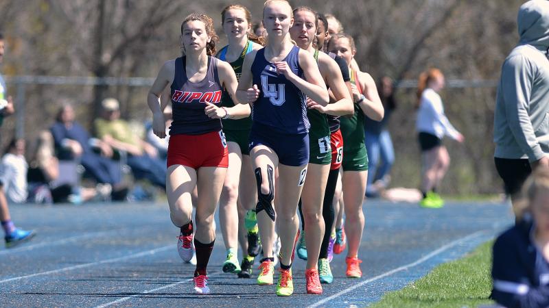 women racing in track race during Viking Invite at Lawrence University