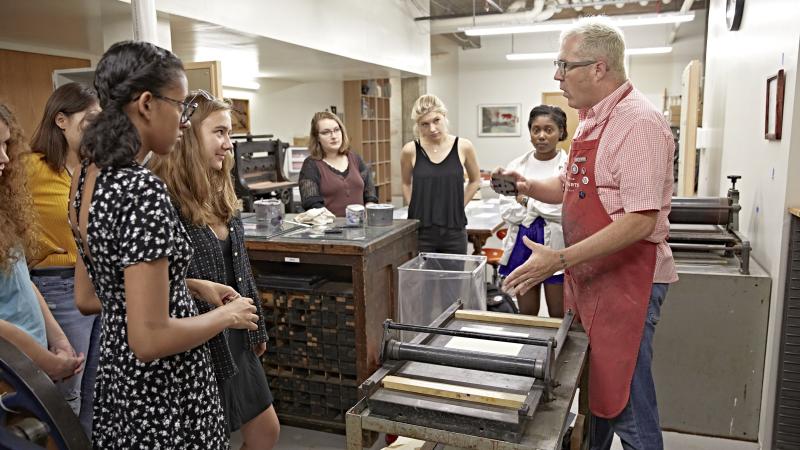Ben Rhinehart teaching printmaking to students