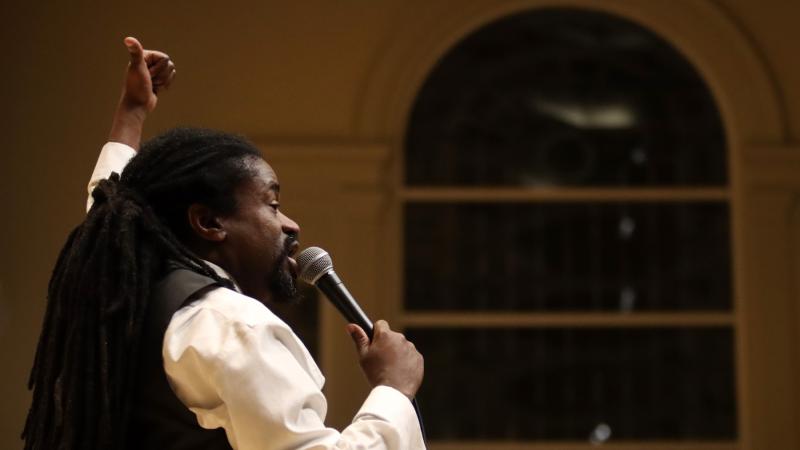 Rev. Sekou leads the audience in song during Monday's MLK Celebration at Memorial Chapel.