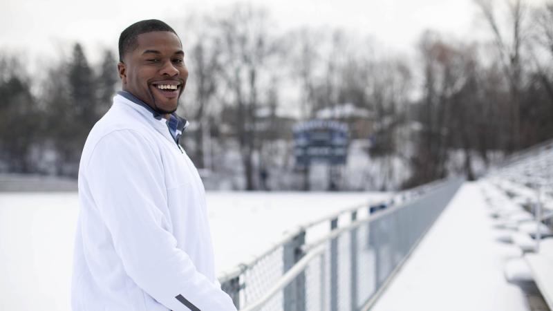 Tony Aker poses for a photo outside the fence at a snow-covered Banta Bowl.