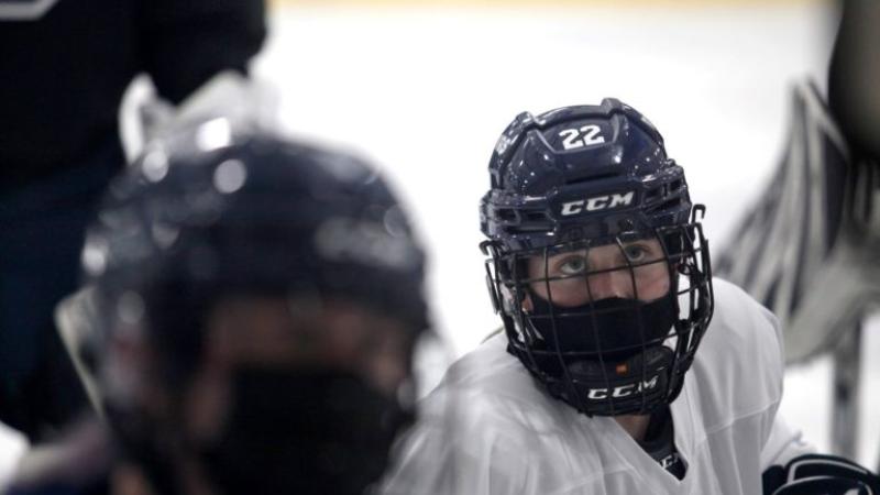 Lauren Askenazy, wearing a hockey uniform, plays in a hockey game.
