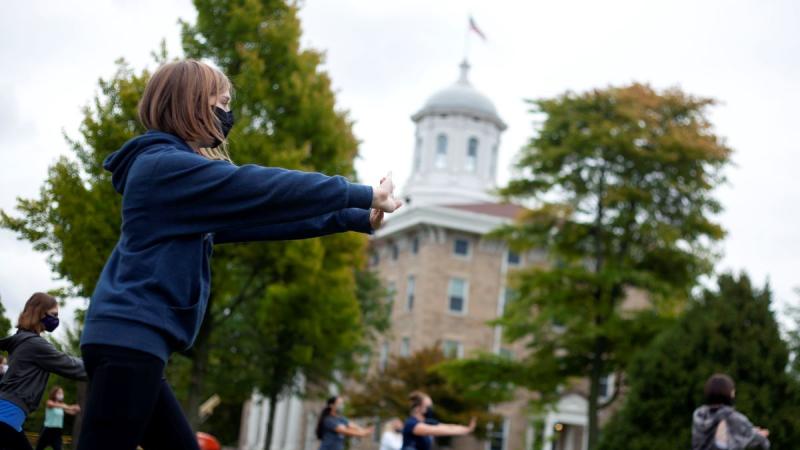 students doing Tai Chi in Main Hall Green