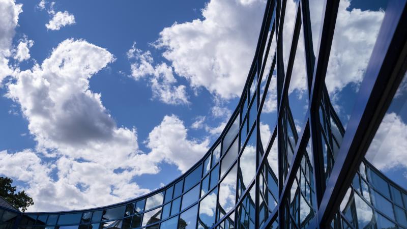 The Wriston Art Center’s windows reflect the clouds Tuesday, June 22, 2021. Photo by Danny Damiani