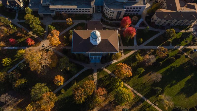 Fall aerial campus view featuring Main Hall