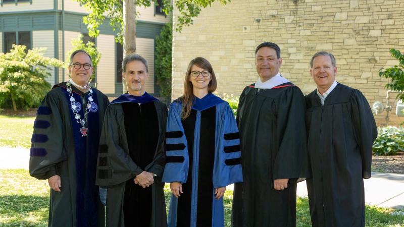 Mark Burstein, three faculty, and the Board of Trustee chair in gowns 
