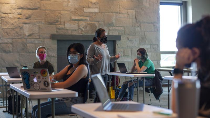 Students receiving class with masks