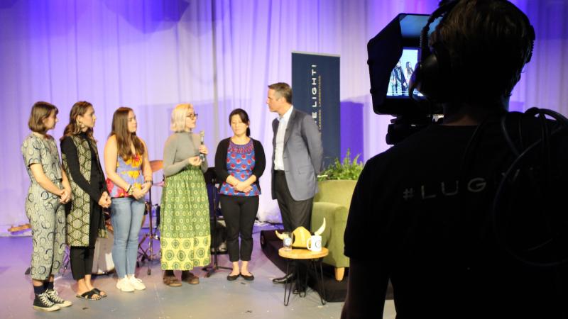 Giving Day webcast, host Terry Moran ’82 interviews Dominica Chang (far right) and the four Lawrence University students (from left) who studied abroad in Senegal 