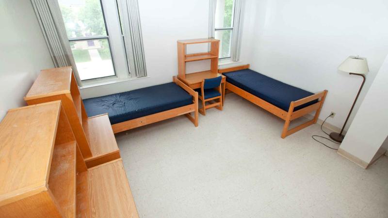 Large room with 2 windows, 2 XL twin beds, 2 desks and 2 drawers