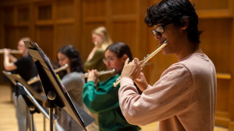 Aayush Raheja, a first-year, playing the flute during Flute Ensemble rehearsal 