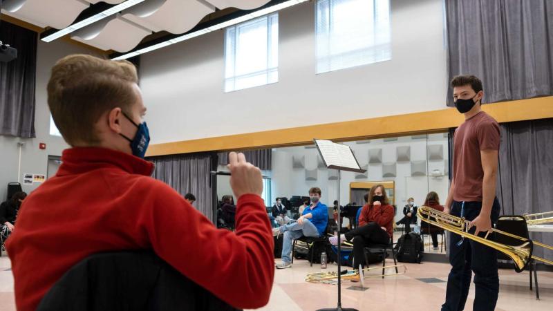 Jackson Guha, a first-year, gets feedback after a performance in trombone studio.