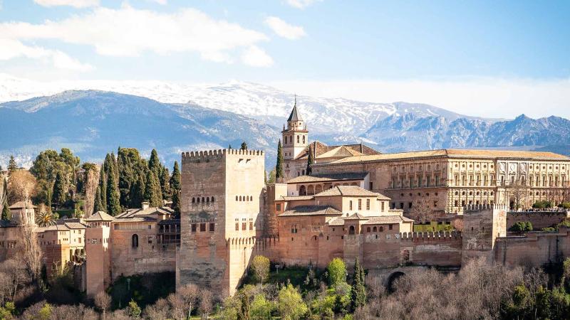 Alhambra palace in spring, Granada, Spain. In early April the mountains are still covered in snow.
