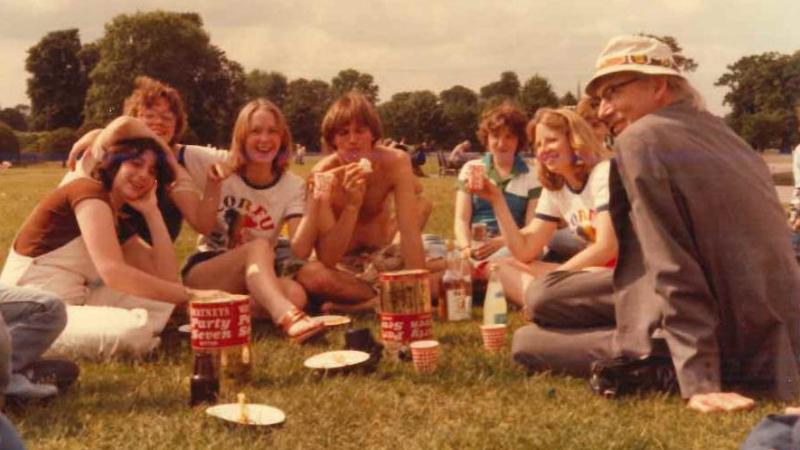 students picnicking in a London park in 1980