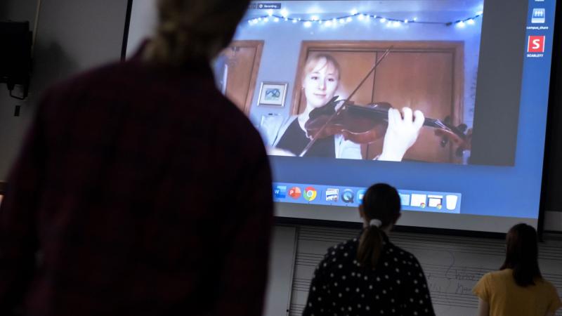 Mindara Krueger-Olson ’22 works through a rehearsal with classmates in a music education class in the Lawrence Conservatory of Music via zoom. 