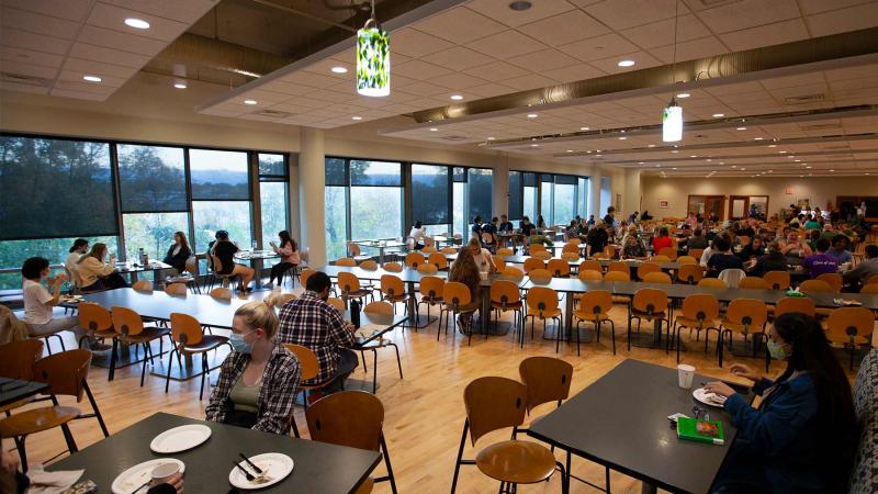 Students gather in Andrew Commons for a meal