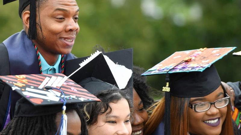 Graduates pose for a picture