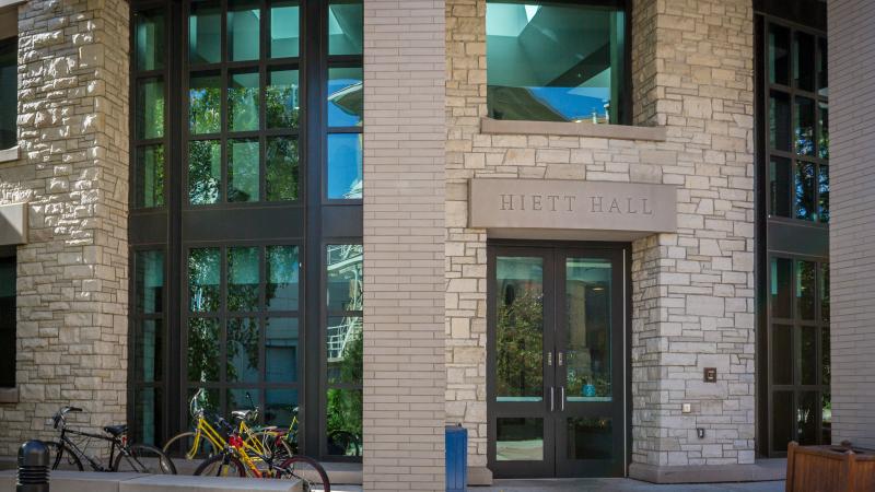The entrance of Hiett Hall with bikes near the door.