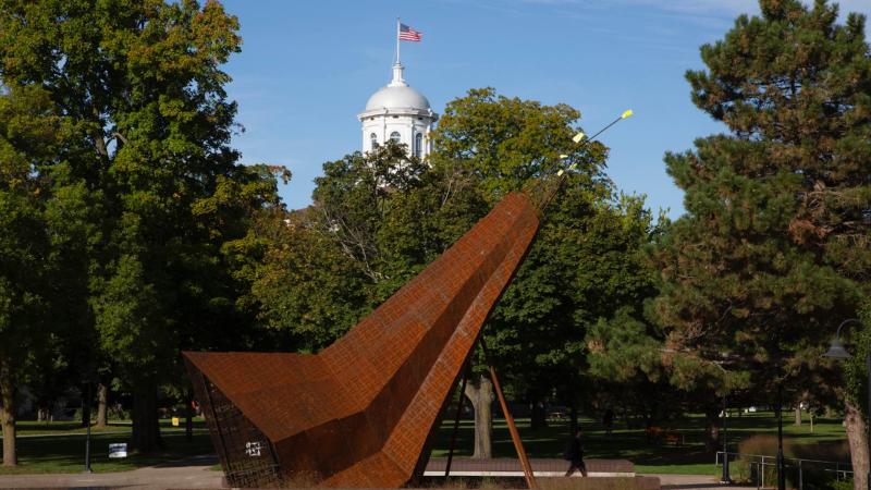 Otaeciah, crane sculpture with Main Hall's cupola peaking out in background.