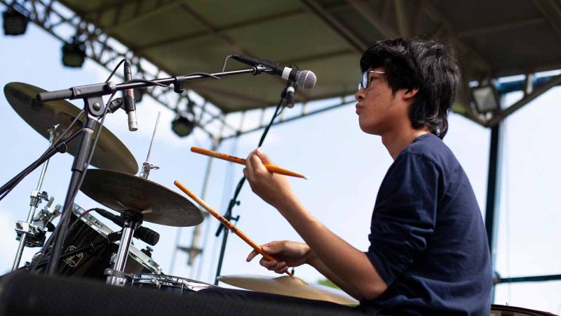 Image of a person playing the drums