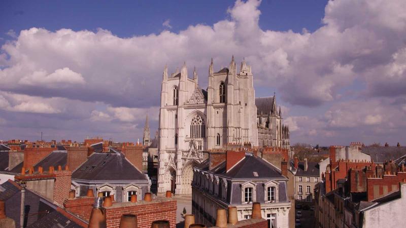 Rooftops of Nantes, France with the Nantes Cathedral in distance