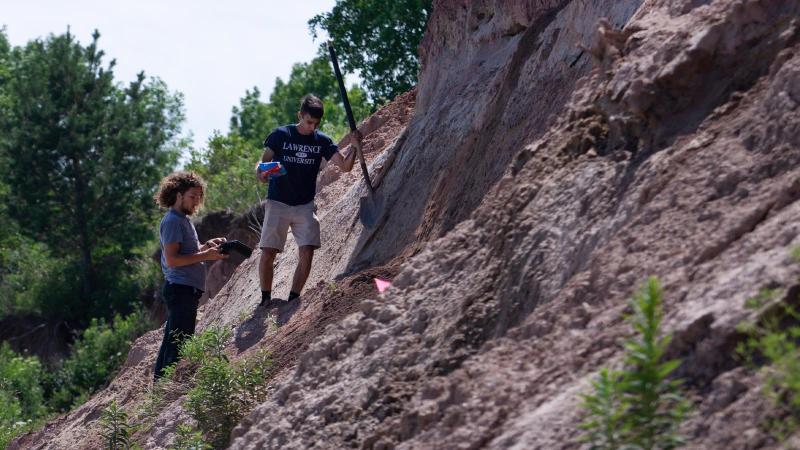 Itai Bojdak-Yates ’23 and Tyler Scott ’23 collect samples while working on the UAV Summer Research Program at Two Creeks Buried State Forest Natural Area 