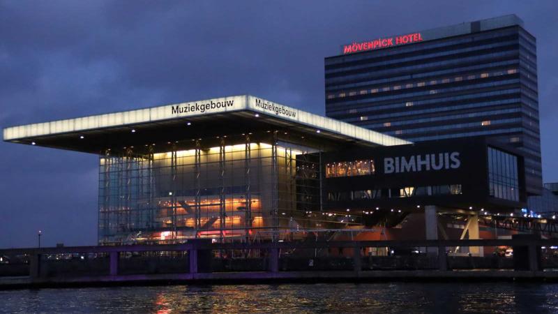 Muziekegebouw concert hall and Bimhuis Jazz Club of Amsterdam, Netherlands with Movenpick Hotel in background 