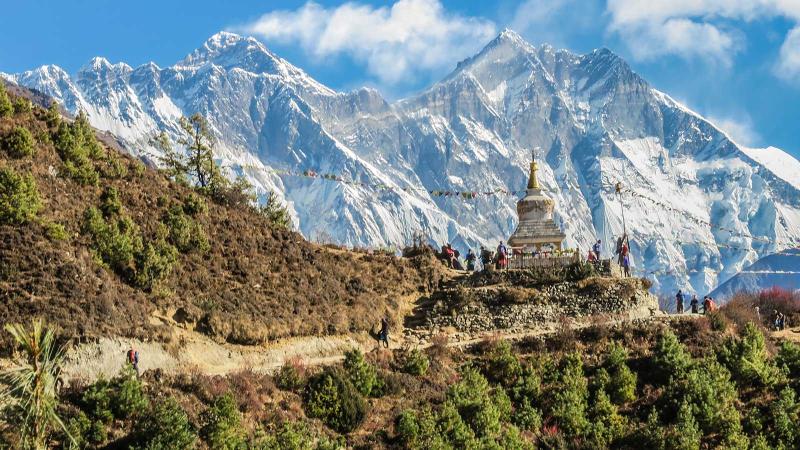 Aerial of a stupa in Namche Bazaar with the Konde Ri mountain in the distance