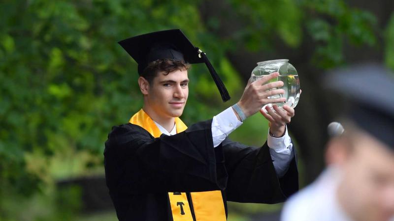 George Mavrakis brought a fish bowl with him to Commencement in 2019.