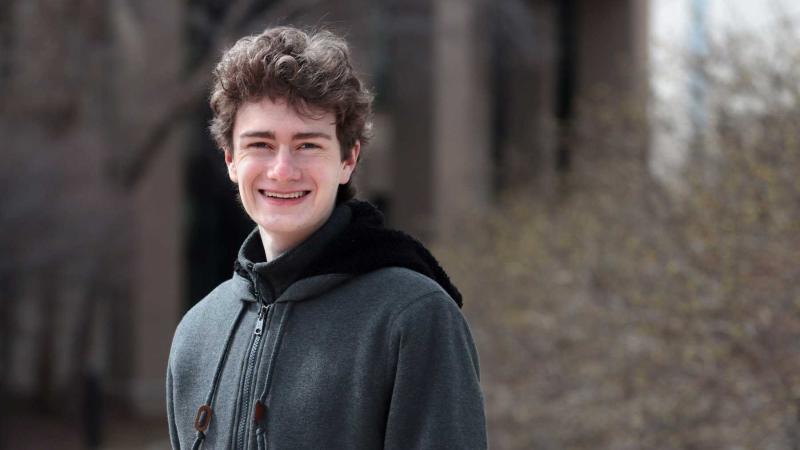 Travis Dillon poses for a portrait on the Lawrence campus.