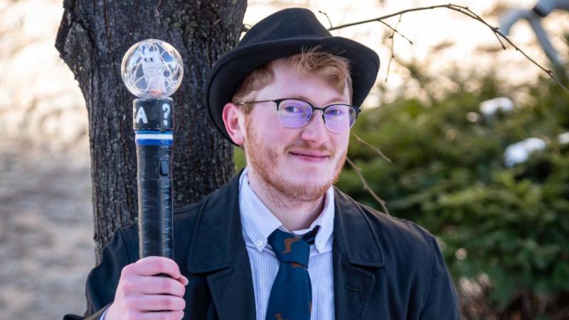 2022 Trivia Head Master Riley Newton poses for a photo on the Lawrence campus.