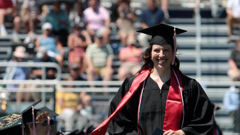 Student wearing regalia at Commencement 2021