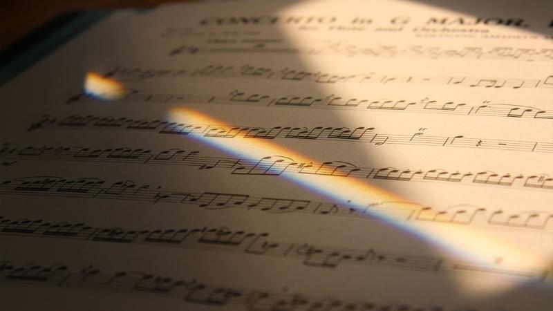 reflected light shining on sheet music