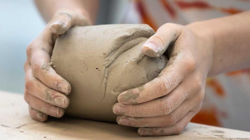 Studio art degree student working with clay in Wriston Art Center Studio, which is open 24x7 to students. 