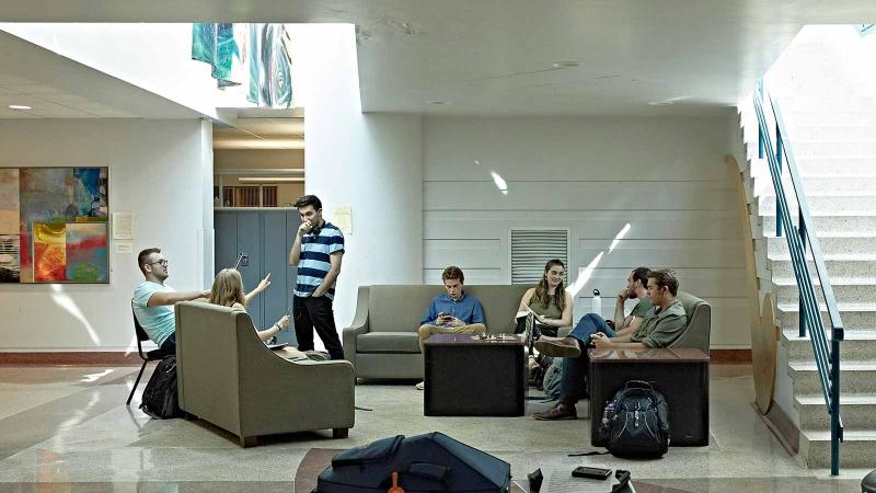 Students gather on couches.