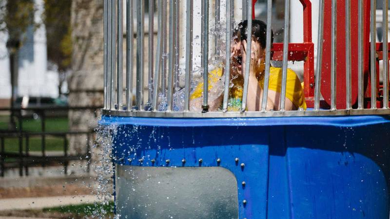 Student in soaked in makeshift water tank.