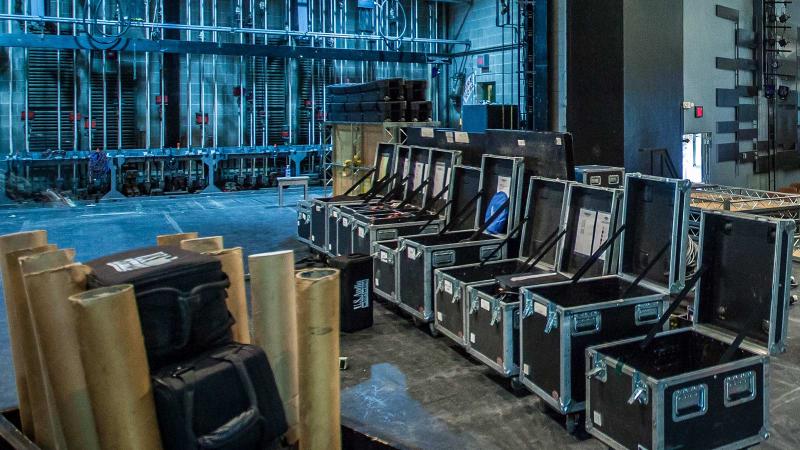 Boxes of equipment sit on Stansbury Theatre's stage