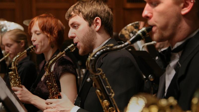 Row of saxophone players during a concert