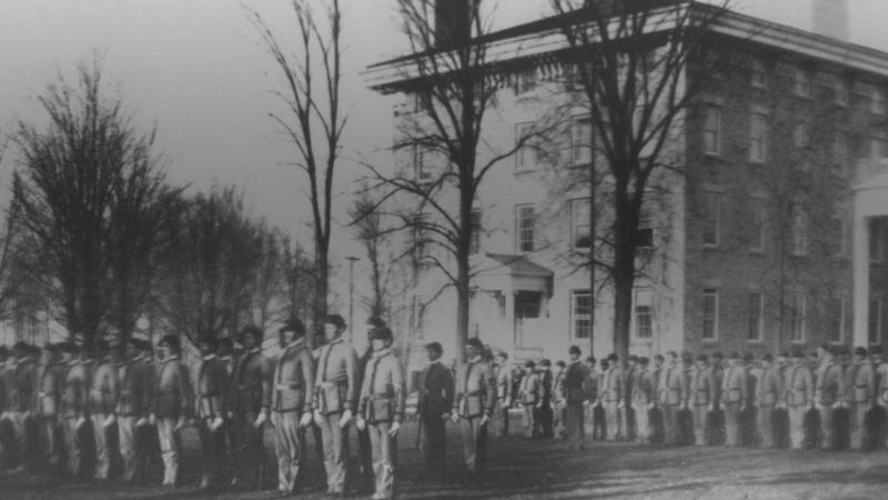Men lined up and around campus in front of Main Hall