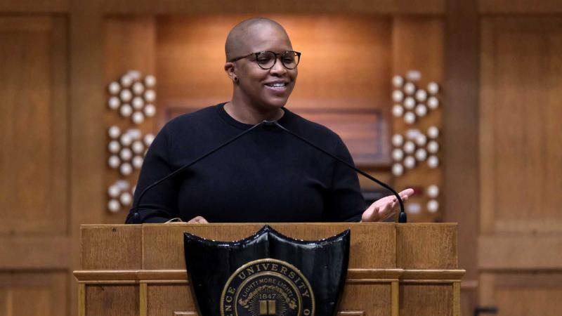 Alexandra Bell stands at the podium on the stage of Memorial Chapel as she delivers her convocation address.