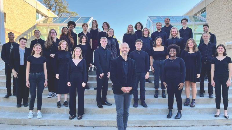 The Lawrence University Concert Choir poses for a photo on the steps near the Music-Drama Center.