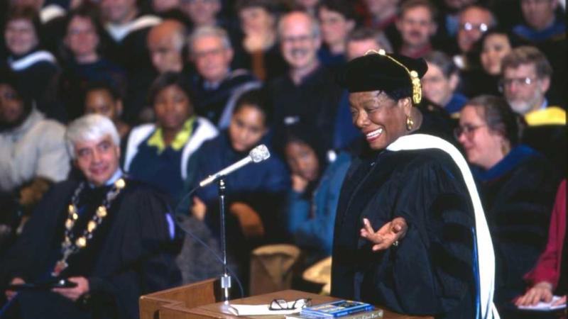 Maya Angelou gestures as she speaks from the podium during a 1997 convocation.