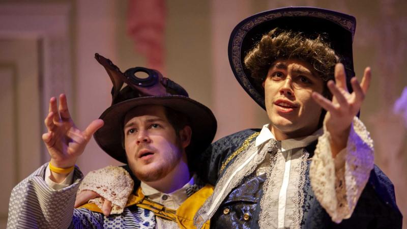 Alec Welhouse, a junior, and Jon Winkler, a sophomore, rehearse in full costume.