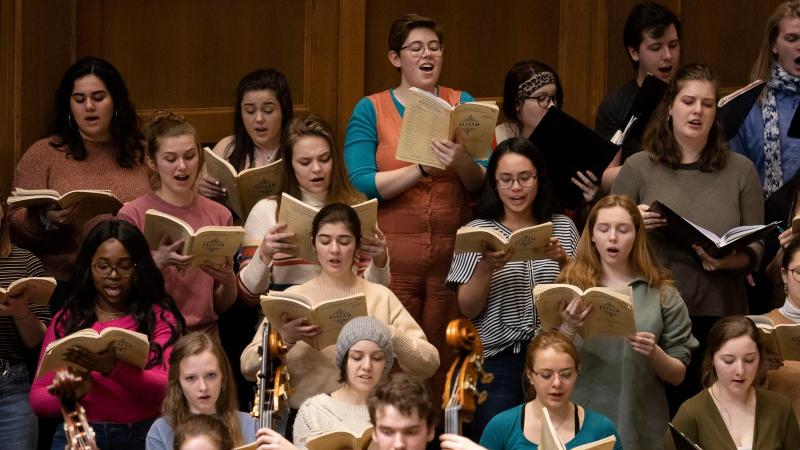 Students singing on stage