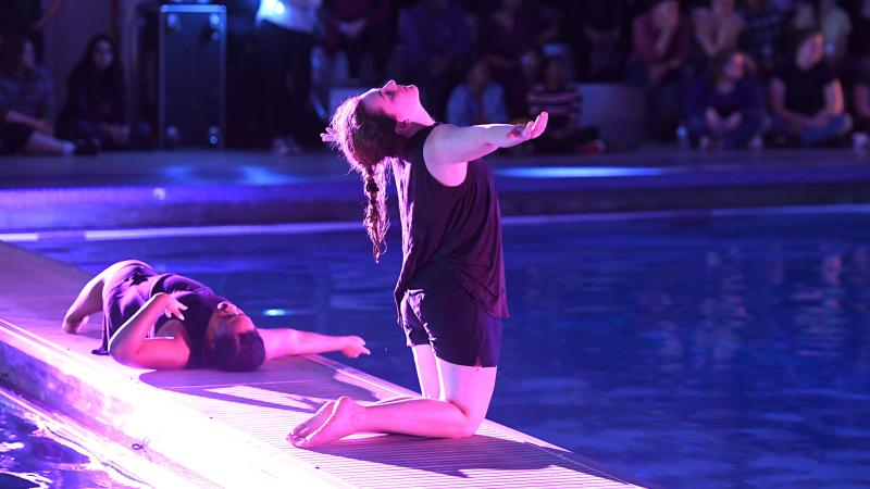 Dancers performing by a pool