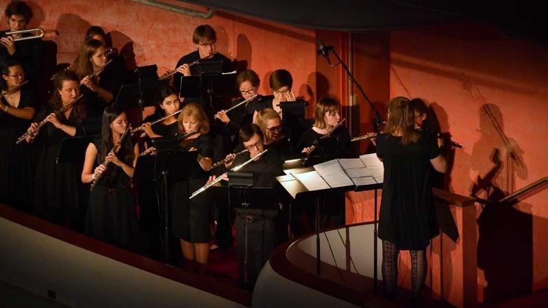 Flute ensemble performs in balcony