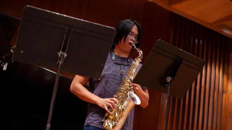 Student plays saxophone