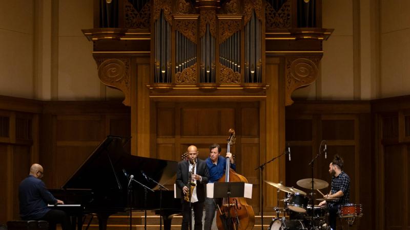 Guest jazz quartet perform on stage in Memorial Chapel.