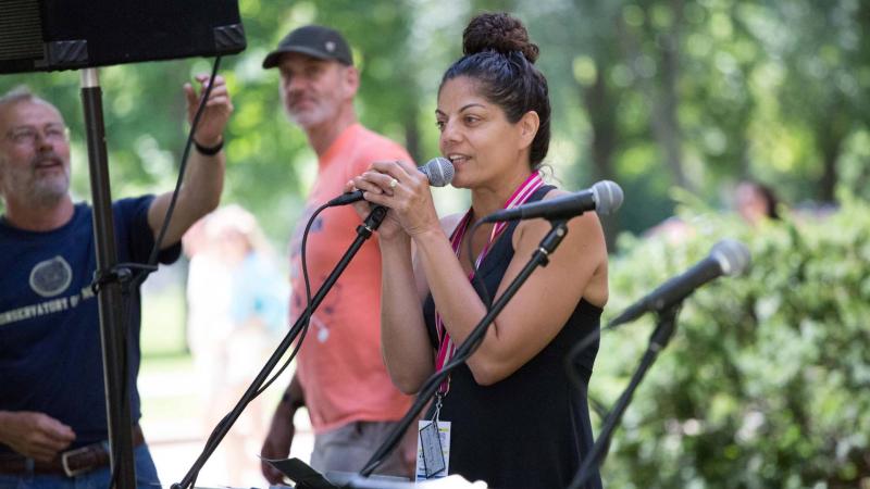 Leila Ramagopal Pertl. music educator from Lawrence University, speaks into a microphone.