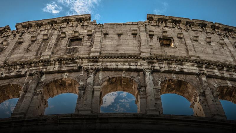 Looking up at one face of the Colosseum in Rome, Italy.